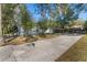 Long driveway leading to a house nestled amongst the trees at 2061 Petit Ct, Apopka, FL 32712