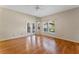 Bright living room featuring hardwood floors and sliding glass doors at 2061 Petit Ct, Apopka, FL 32712