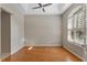 Bright home office features wood floors and a ceiling fan at 2061 Petit Ct, Apopka, FL 32712