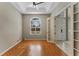 Bright home office features wood floors, ceiling fan, and French doors at 2061 Petit Ct, Apopka, FL 32712