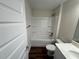 Bathroom with single sink, tub shower combo, and vinyl wood flooring at 238 Locust Rd, Ocala, FL 34472
