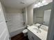 Bathroom featuring single sink with granite countertop and tub shower combo at 238 Locust Rd, Ocala, FL 34472