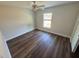 Cozy bedroom is bright with natural light, has wood floors and has a ceiling fan providing added comfort at 238 Locust Rd, Ocala, FL 34472