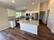 Modern kitchen boasts granite countertops, stainless steel appliances, and ample cabinet space, enhancing functionality at 238 Locust Rd, Ocala, FL 34472
