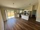 Eat-in kitchen with stainless steel appliances, granite countertops, and modern white cabinetry at 238 Locust Rd, Ocala, FL 34472