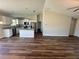 Open-concept living area showcases a spacious kitchen with stainless appliances, perfect for gatherings and modern living at 238 Locust Rd, Ocala, FL 34472