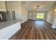 Open-concept living room with wood-look floors and abundant natural light at 238 Locust Rd, Ocala, FL 34472
