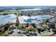Bird's-eye view of a house near a lake in a residential area at 250 Bayou Bend Rd, Groveland, FL 34736