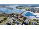 Aerial view showing home's location near a lake in a quiet community at 250 Bayou Bend Rd, Groveland, FL 34736
