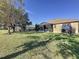 Large backyard with grassy area at 250 Bayou Bend Rd, Groveland, FL 34736