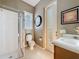Updated bathroom with shower, toilet, and vanity at 250 Bayou Bend Rd, Groveland, FL 34736
