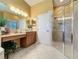 Modern bathroom with a large shower and double sinks at 250 Bayou Bend Rd, Groveland, FL 34736