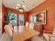 Bright dining room with hardwood floors and an accent wall at 250 Bayou Bend Rd, Groveland, FL 34736