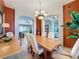 Elegant dining room with arched entryways and warm color palette at 250 Bayou Bend Rd, Groveland, FL 34736