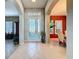 Elegant entryway with tiled floor and glass front door at 250 Bayou Bend Rd, Groveland, FL 34736