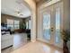 Bright and spacious entryway with tiled floors and an arched doorway at 250 Bayou Bend Rd, Groveland, FL 34736
