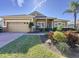 Two-story house with attached garage and landscaped yard at 250 Bayou Bend Rd, Groveland, FL 34736