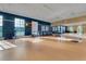 Bright fitness room with various exercise equipment and large mirrors at 250 Bayou Bend Rd, Groveland, FL 34736