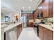 Spacious kitchen with stainless steel appliances and an eat-in island at 250 Bayou Bend Rd, Groveland, FL 34736