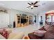 Open living room showcasing a large TV and ample seating at 250 Bayou Bend Rd, Groveland, FL 34736