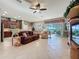 Combined living and kitchen area with access to a patio at 250 Bayou Bend Rd, Groveland, FL 34736