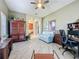 Home office with built-in shelving, a comfortable couch, and a work desk at 250 Bayou Bend Rd, Groveland, FL 34736