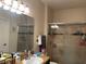 Bathroom with granite vanity, large mirror and shower at 2558 Robert Trent Jones Dr # 1427, Orlando, FL 32835