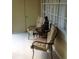 Small patio with two chairs and a small table at 2558 Robert Trent Jones Dr # 1427, Orlando, FL 32835