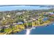 Aerial view of lakefront homes with lush landscaping and private docks at 2934 Marquesas Ct, Windermere, FL 34786