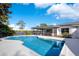 Inviting kidney-shaped pool with expansive lake view at 2934 Marquesas Ct, Windermere, FL 34786