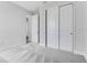 Neutral bedroom offers gray carpet, two closets, and doorways, creating an open and inviting atmosphere at 2987 Arranmore Dr, Ormond Beach, FL 32174
