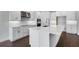 Modern kitchen with a marble top island, modern stainless appliances, and white shaker cabinets at 2987 Arranmore Dr, Ormond Beach, FL 32174