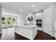 Bright kitchen featuring a large center island, modern appliances, and white cabinetry at 2987 Arranmore Dr, Ormond Beach, FL 32174