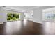 Open-concept living space showcasing seamless access to the kitchen and an outdoor patio through sliding glass doors at 2987 Arranmore Dr, Ormond Beach, FL 32174
