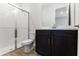 Bathroom featuring dark wood vanity, white countertop and subway tile shower at 2995 Arranmore Dr, Ormond Beach, FL 32174