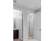 Hallway featuring white doors leading to the bathroom and bedroom at 2995 Arranmore Dr, Ormond Beach, FL 32174
