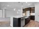 Bright kitchen featuring a large island, stainless steel appliances, and a farmhouse sink at 2995 Arranmore Dr, Ormond Beach, FL 32174