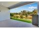 Covered patio with picturesque views of a pond and lush greenery at 2995 Arranmore Dr, Ormond Beach, FL 32174