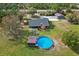 Aerial view showing the house, detached garage, and a large backyard with a pool at 3401 Abalone Blvd, Orlando, FL 32833