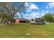 Large backyard with a home, pool, and shed at 3401 Abalone Blvd, Orlando, FL 32833