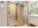 Beautifully renovated bathroom with a large shower, dual shower heads, and bench seating at 3401 Abalone Blvd, Orlando, FL 32833