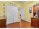 Bedroom or office space with a closet, desk, and wood floors at 3401 Abalone Blvd, Orlando, FL 32833
