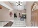 Grand foyer featuring high ceilings, tile flooring, and an open view to the living room at 3401 Abalone Blvd, Orlando, FL 32833