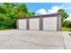Three-car garage with white roll-up doors at 3401 Abalone Blvd, Orlando, FL 32833