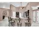 Kitchen features a breakfast bar with seating, dark wood cabinets and stainless steel appliances at 3401 Abalone Blvd, Orlando, FL 32833