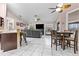 Open living room and kitchen area with a large sectional sofa and flat-screen TV at 3401 Abalone Blvd, Orlando, FL 32833