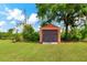 Outdoor storage shed with a roll-up door at 3401 Abalone Blvd, Orlando, FL 32833