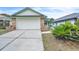 Brick home with attached garage and landscaped yard at 4340 Sandhurst Dr, Orlando, FL 32817