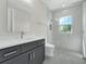 Modern bathroom with glass shower and a dark vanity at 500 W Hazel St, Orlando, FL 32804