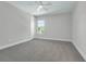Bedroom with neutral walls and carpet, a ceiling fan and bright window at 500 W Hazel St, Orlando, FL 32804